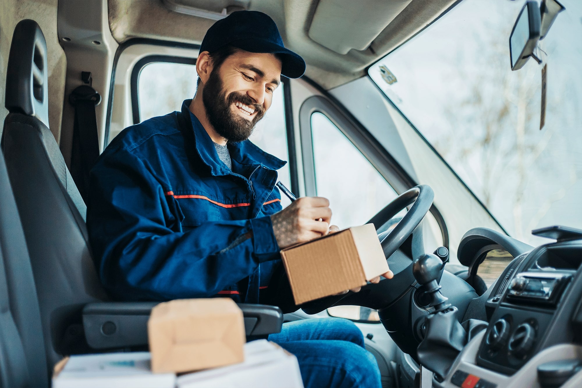Man delivering packages in his delivery truck or van.