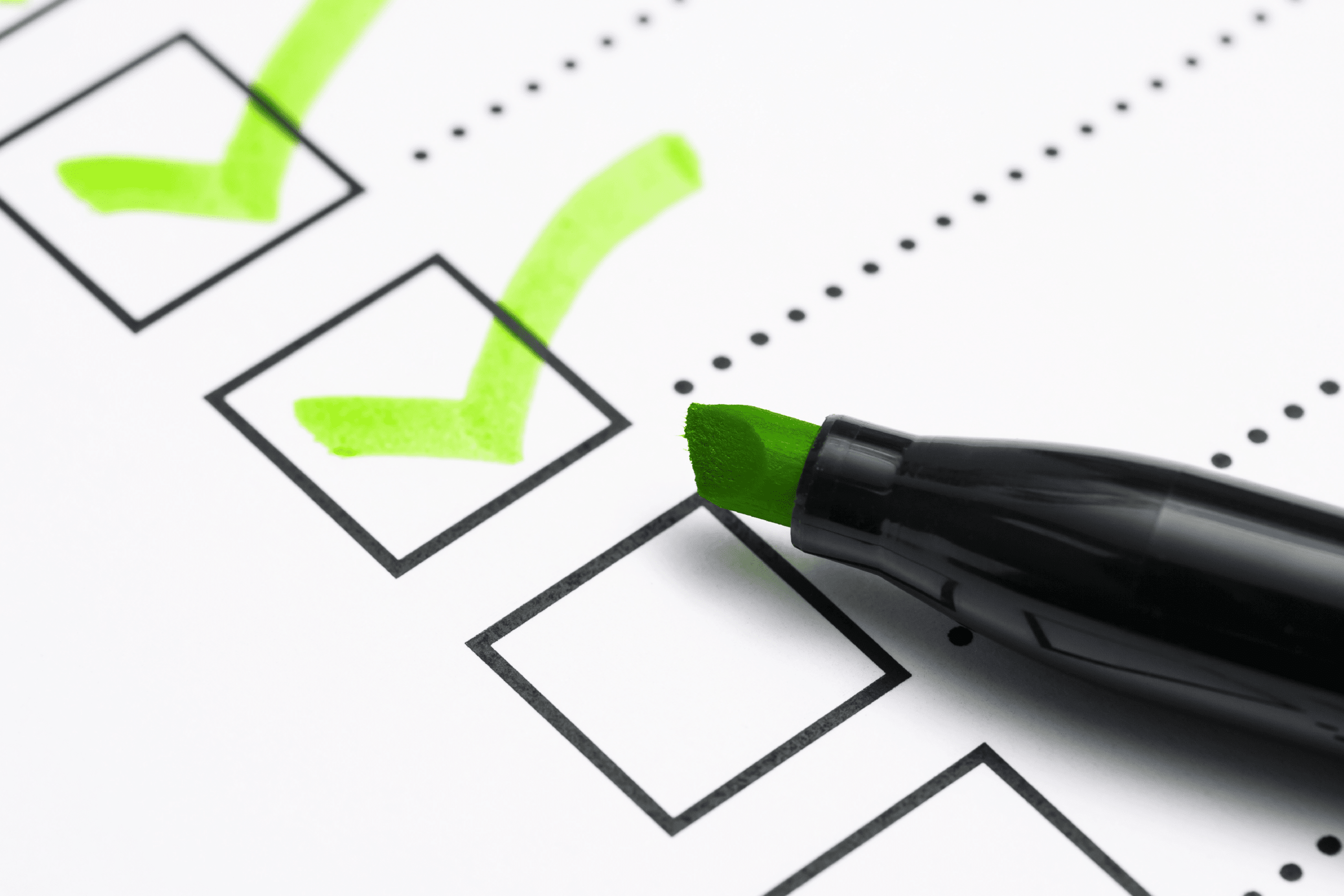 Green marker pen over marked checkboxes