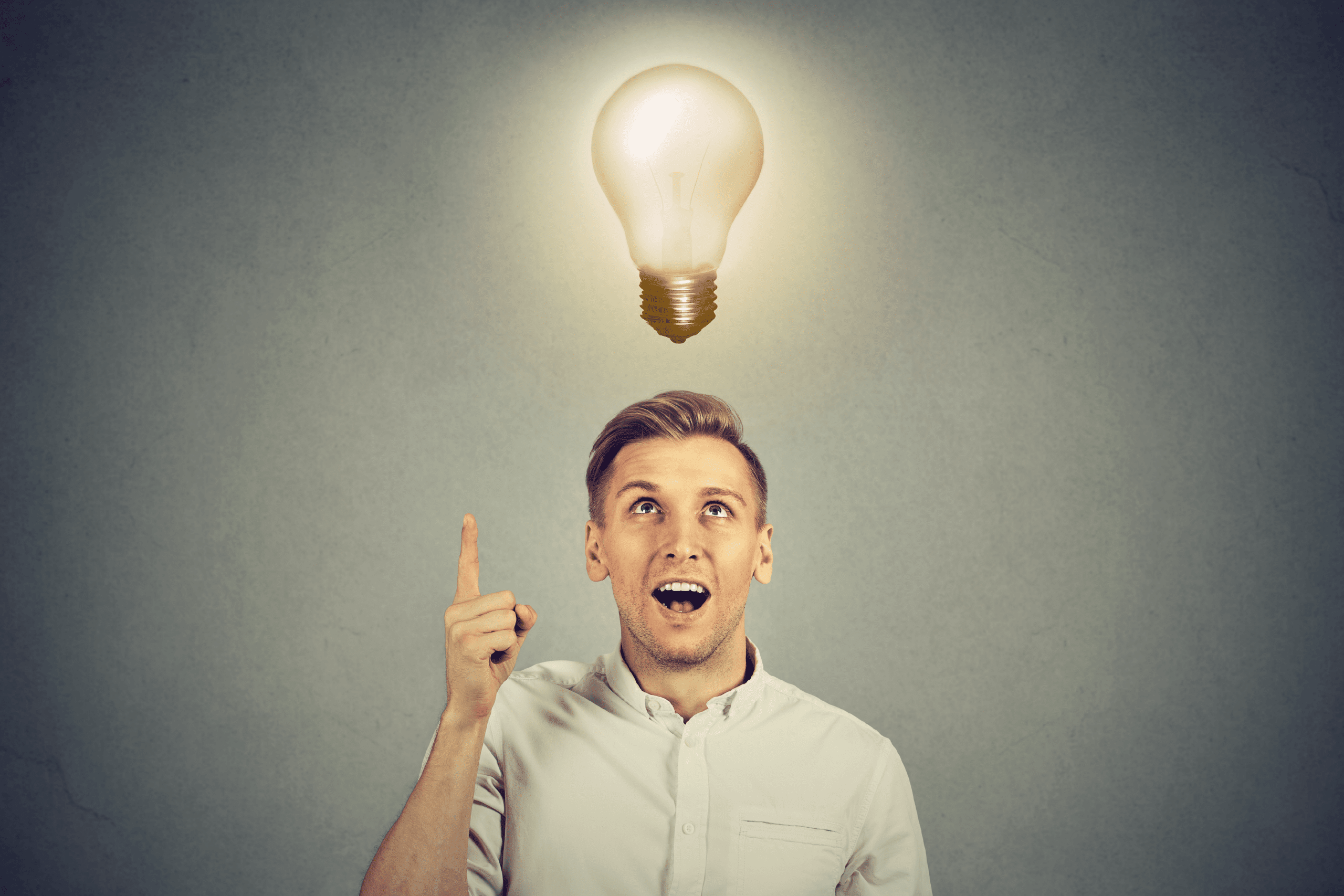 Business Man With Idea Light Bulb Over Head